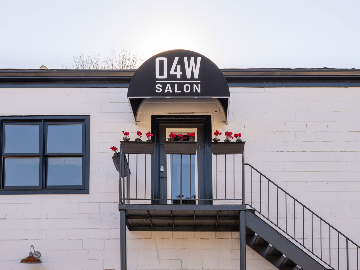 The exterior door of O4W Salon